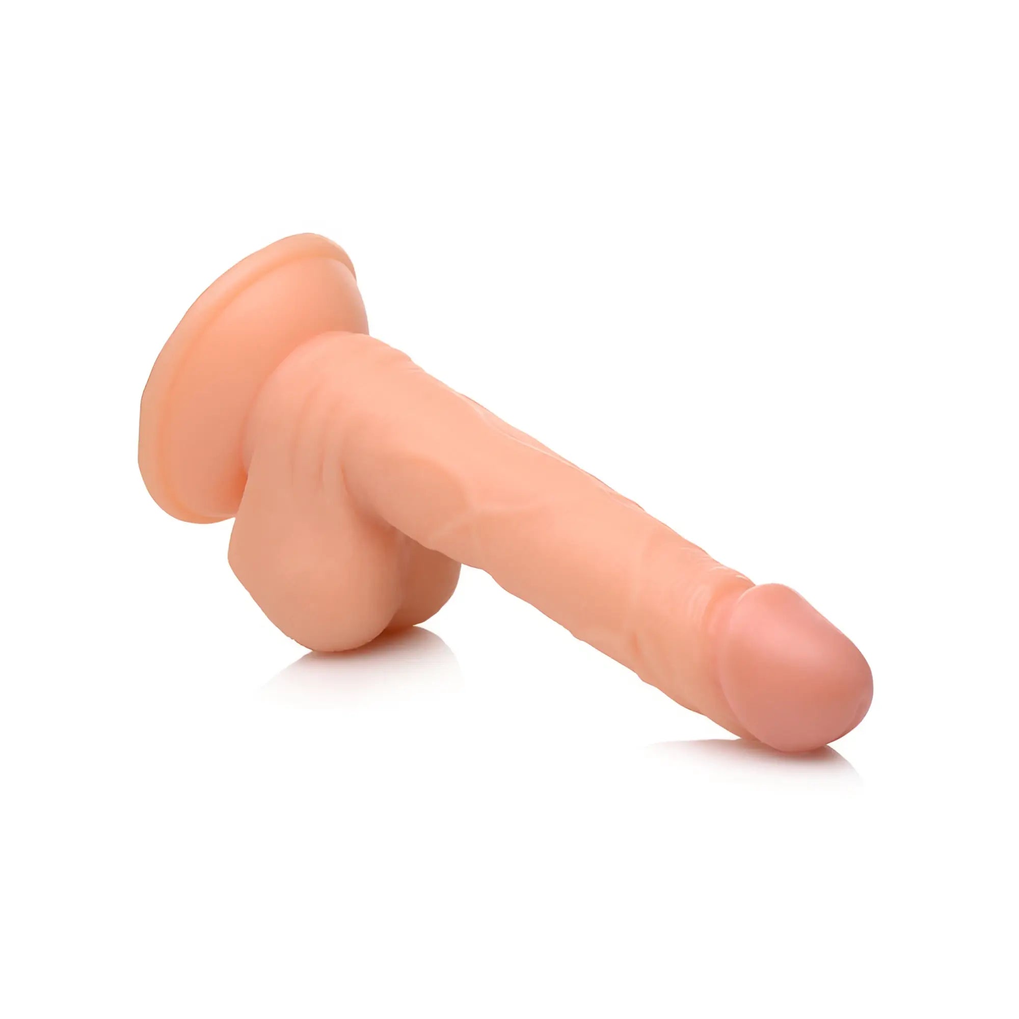 Pop Peckers 6.5-inch realistic skin-toned dildo featuring detailed texture, testicles, and a suction cup base.