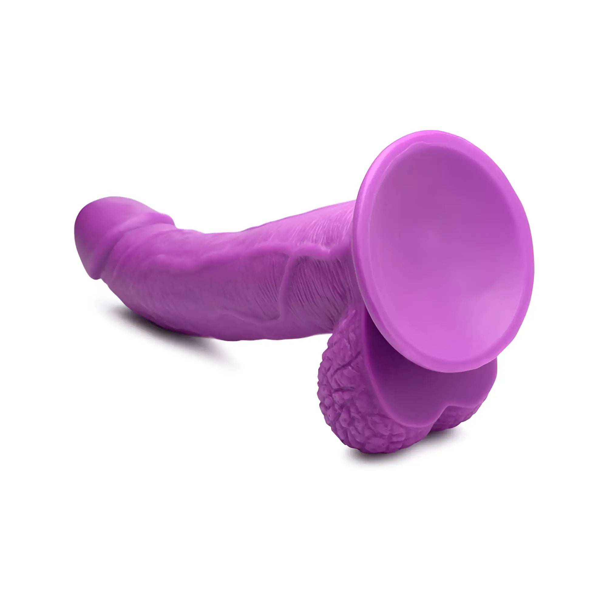 Pop Peckers 7.5-inch purple curved dildo with textured balls and a suction cup base, isolated on a white background.