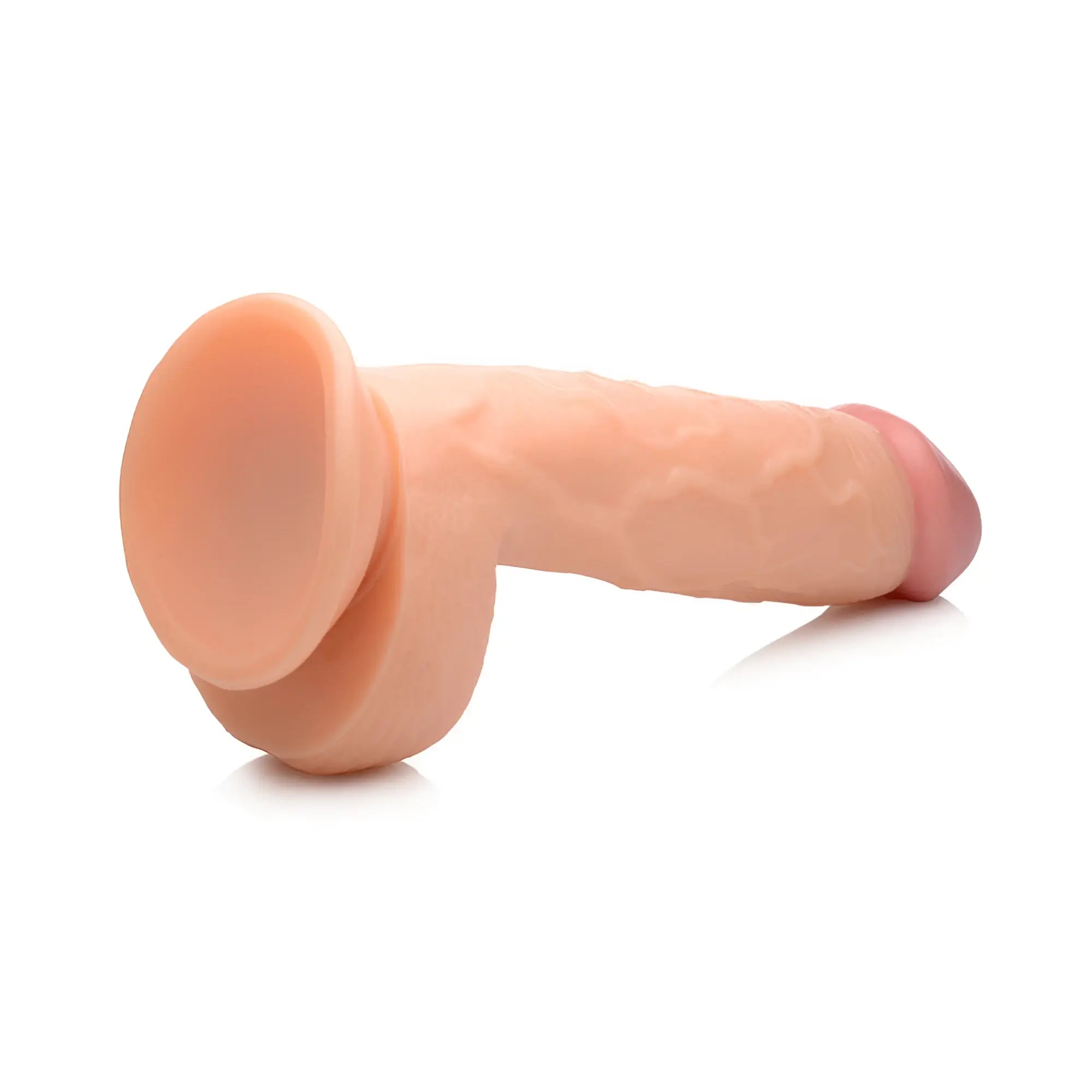 Pop Peckers 8.25-inch flesh-toned realistic dildo with textured shaft, defined balls, and suction cup base.
