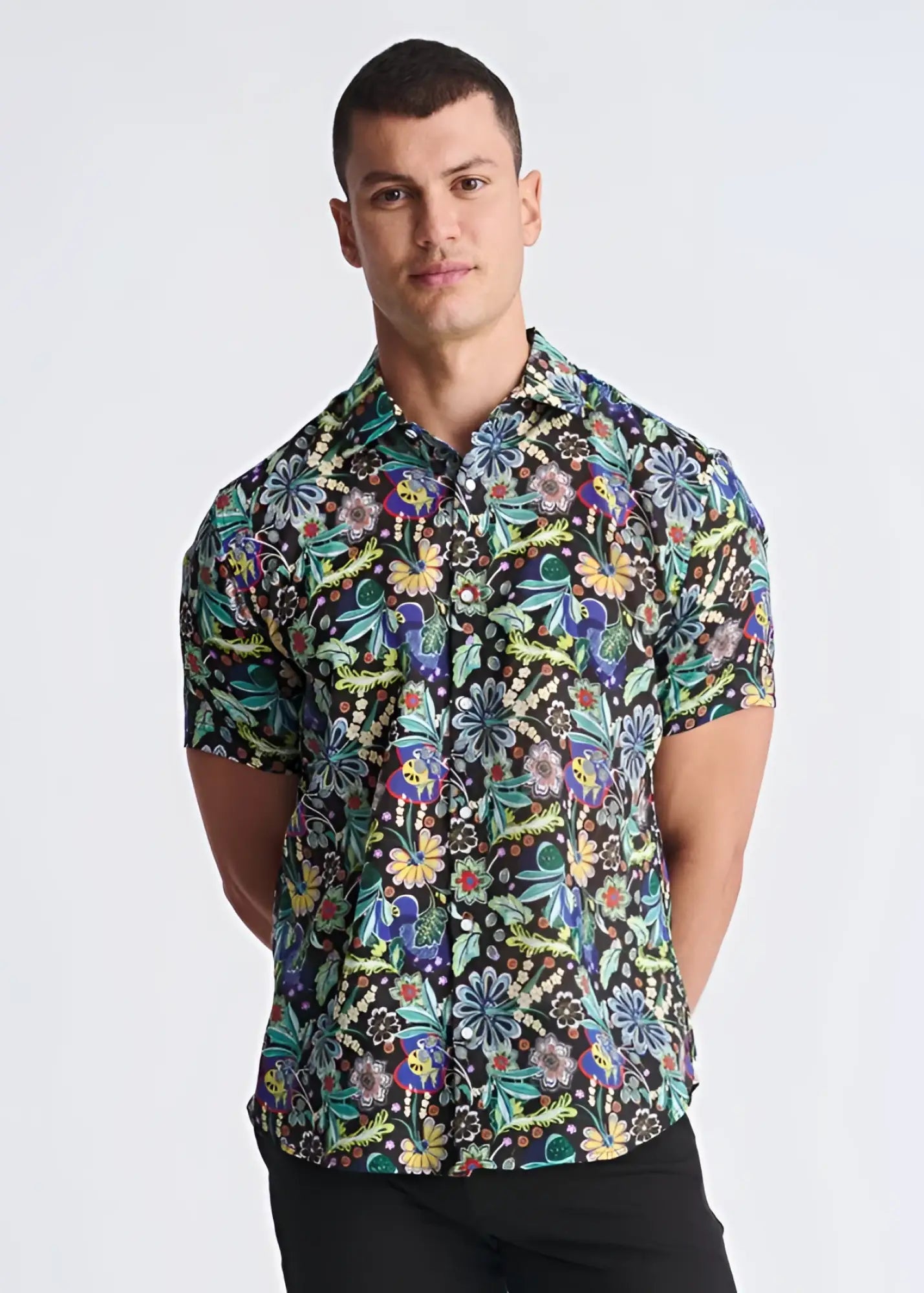 A vibrant short-sleeved floral lightweight linen tencel shirt with multicolored pattern on dark background