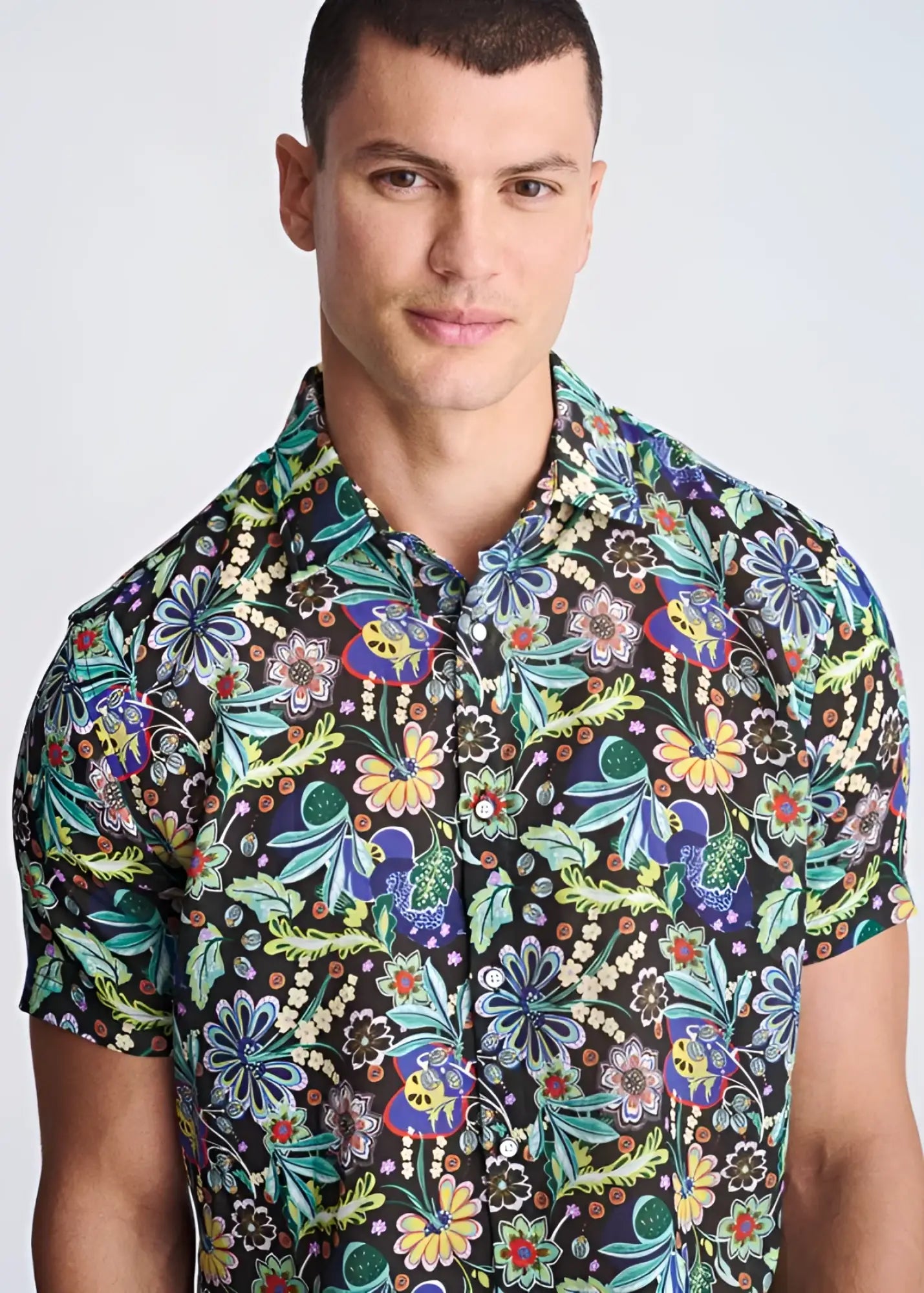Floral lightweight linen tencel short sleeve shirt with vibrant green blue yellow and purple floral pattern on dark background