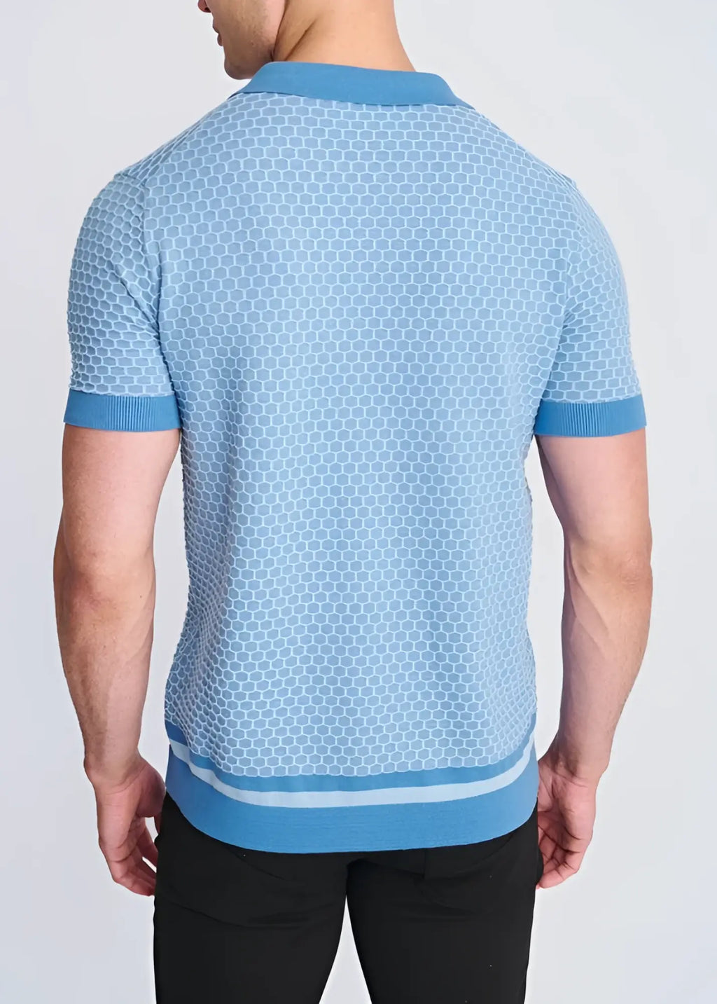 Light blue short-sleeved honeycomb textured knit polo shirt with subtle hexagonal pattern ribbed trim and button front