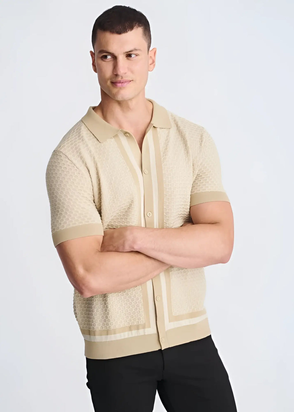 Beige honeycomb textured knit polo shirt with subtle vertical stripes and ribbed cuffs button front design