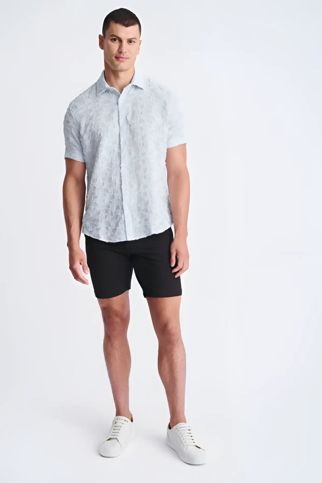 Light blue lightweight jaquard short-sleeved shirt with subtle floral pattern perfect for warm weather wear