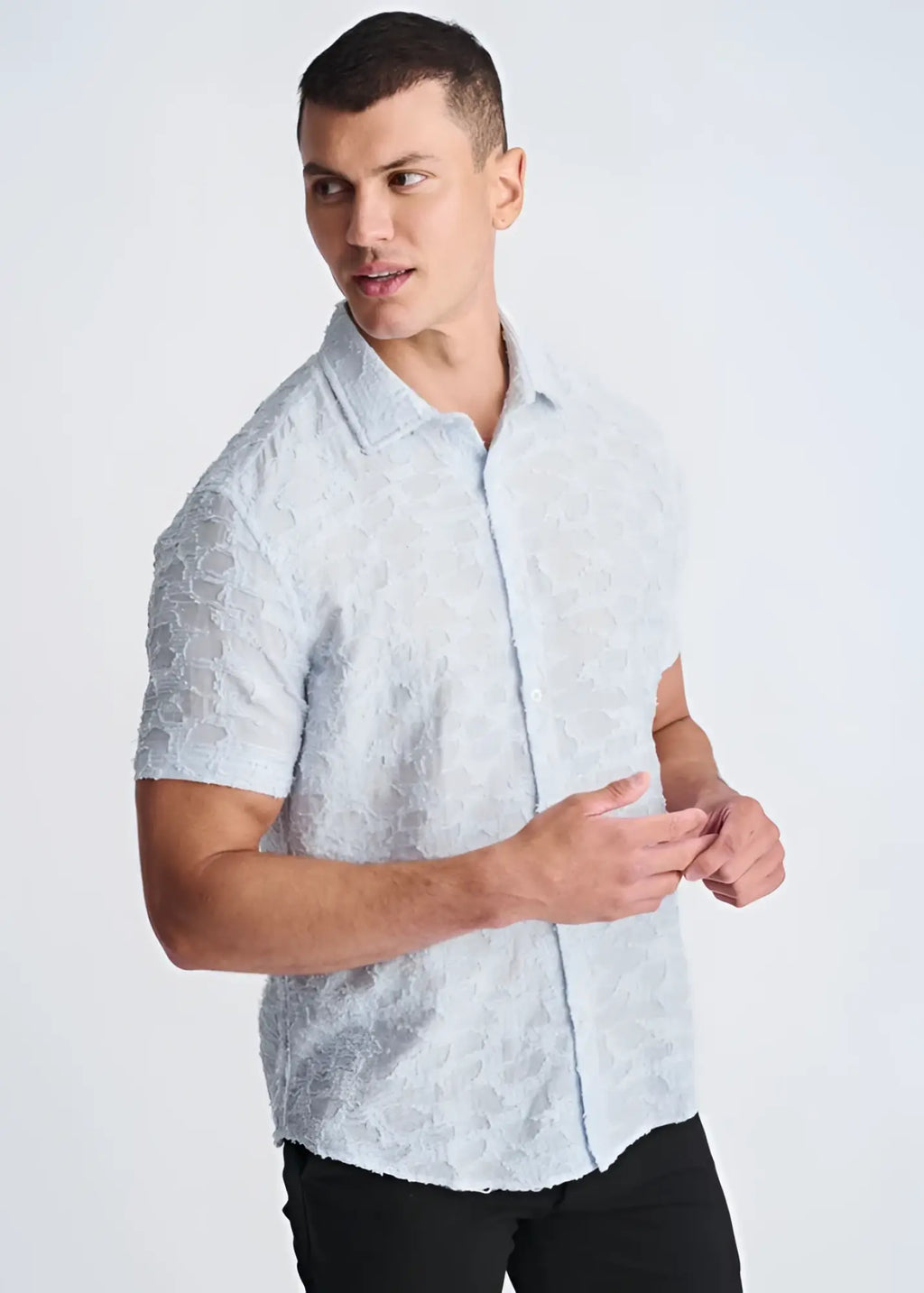 Light blue lightweight jacquard short-sleeved button-up shirt with a subtle textured pattern for summer wear