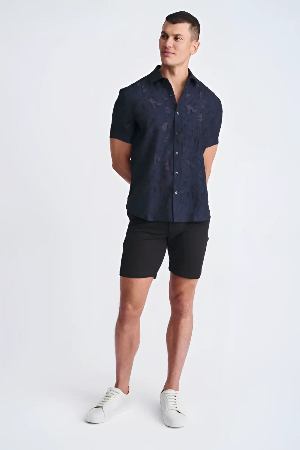 A navy blue lightweight jacquard short-sleeved shirt with a subtle floral pattern for casual wear