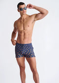 Blue peacock feathers seersucker swim shorts with mesh lining featuring orange and yellow ice cream cone pattern