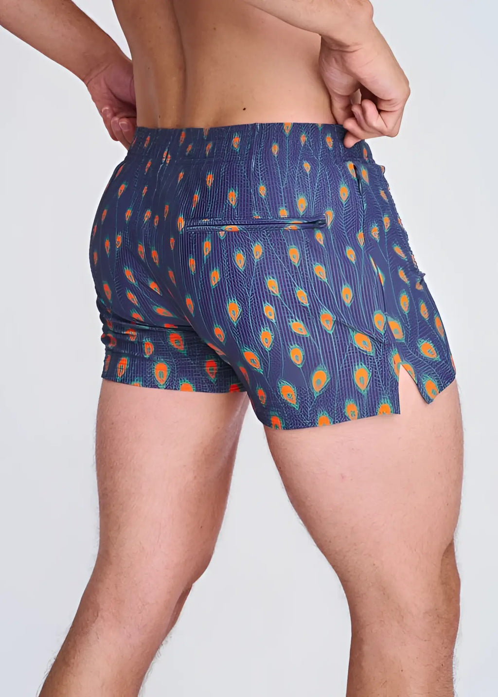 Blue peacock feathers seersucker swim shorts with vibrant orange and teal feather pattern elastic waistband and side slit