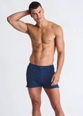 Navy blue Riviera seersucker swim shorts with mesh lining and single button closure at the waistband