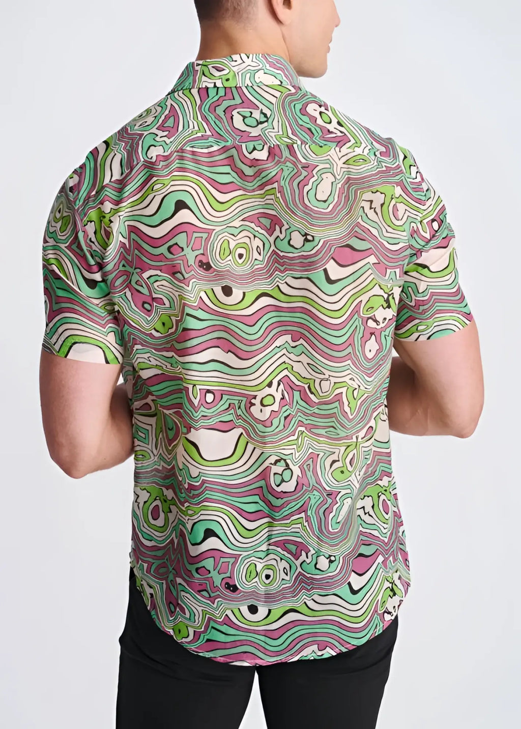 A vibrant lightweight cotton silk short-sleeved shirt with a green pink and white psychedelic swirling pattern
