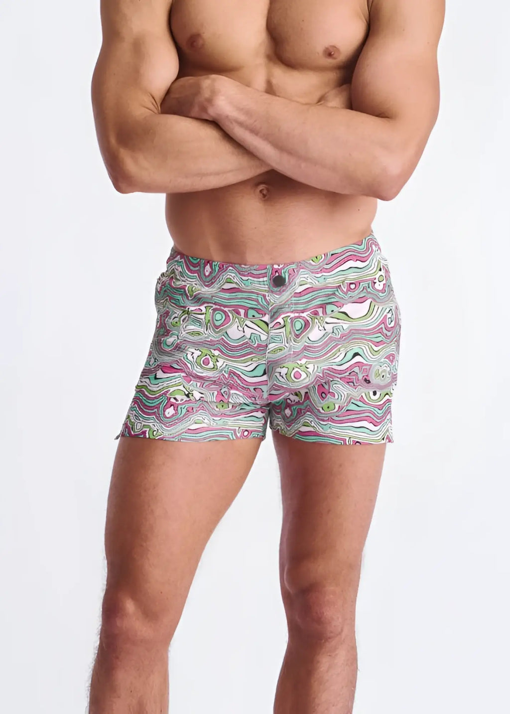 Swirls print seersucker swim shorts with mesh lining in vibrant pink green and white wavy abstract pattern