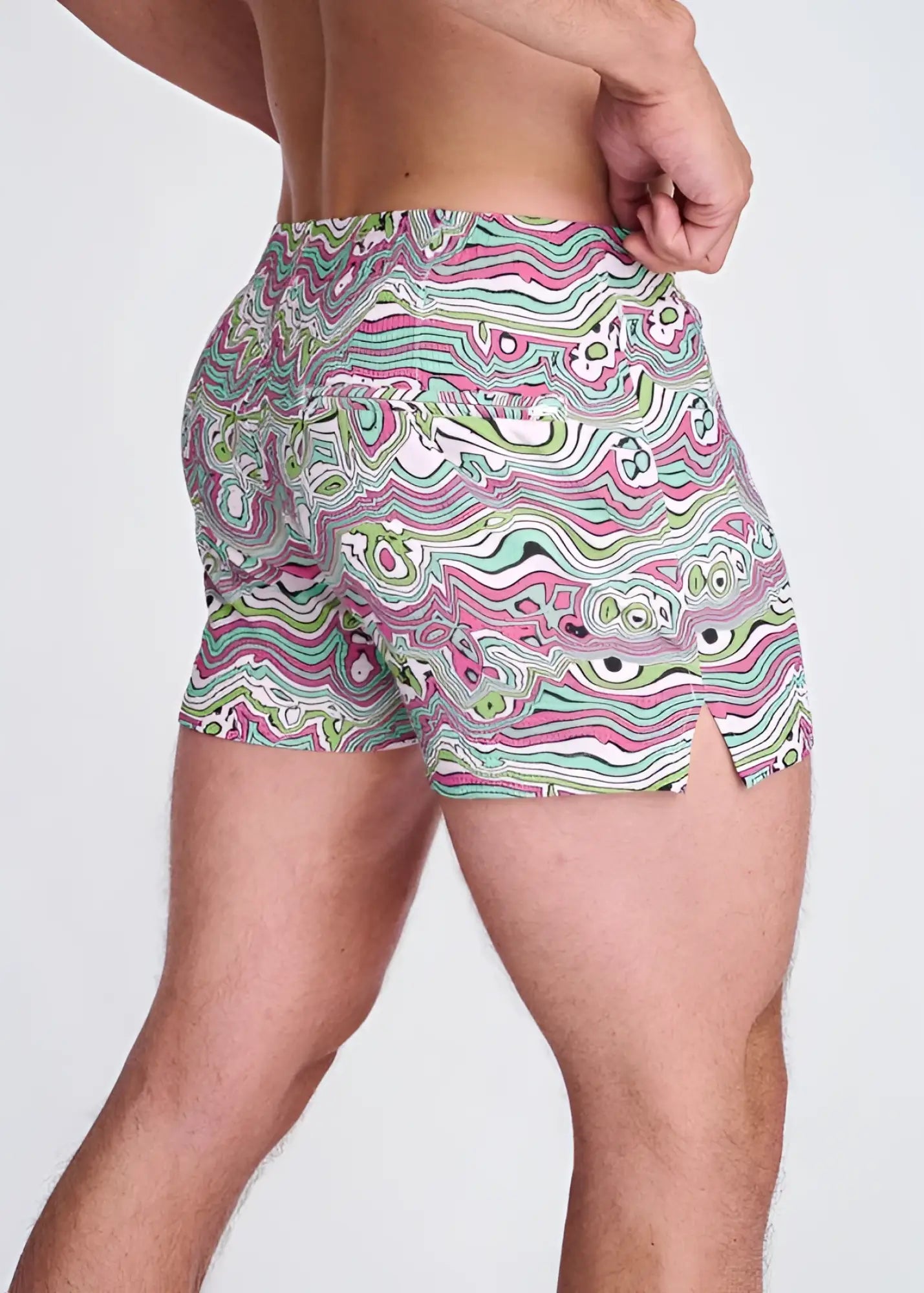 Swirls print seersucker swim shorts with mesh lining in vibrant pink green and white wavy psychedelic pattern