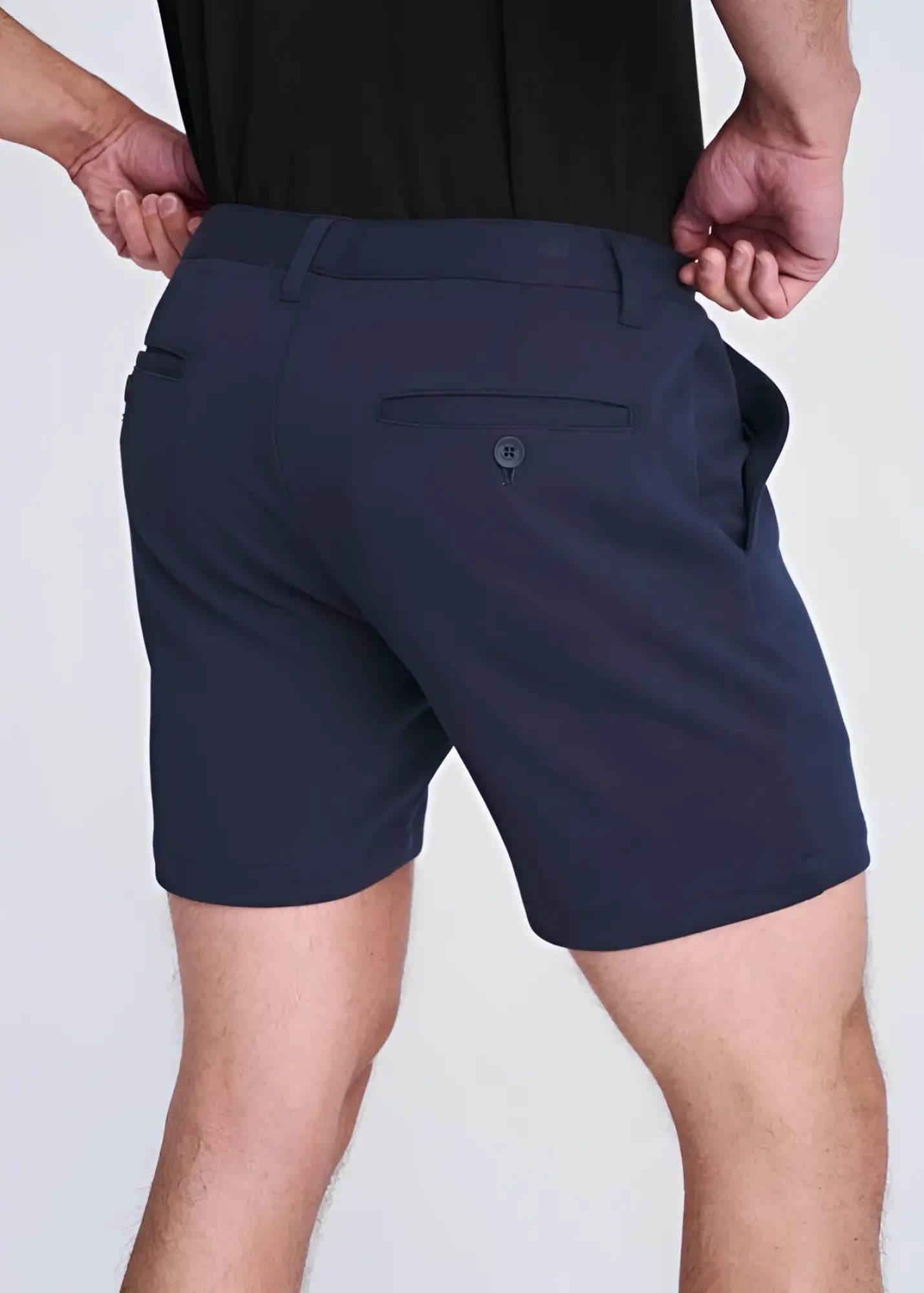 Dark navy blue textured stretch knit chino shorts with tailored fit and subtle button detail on the back pocket view
