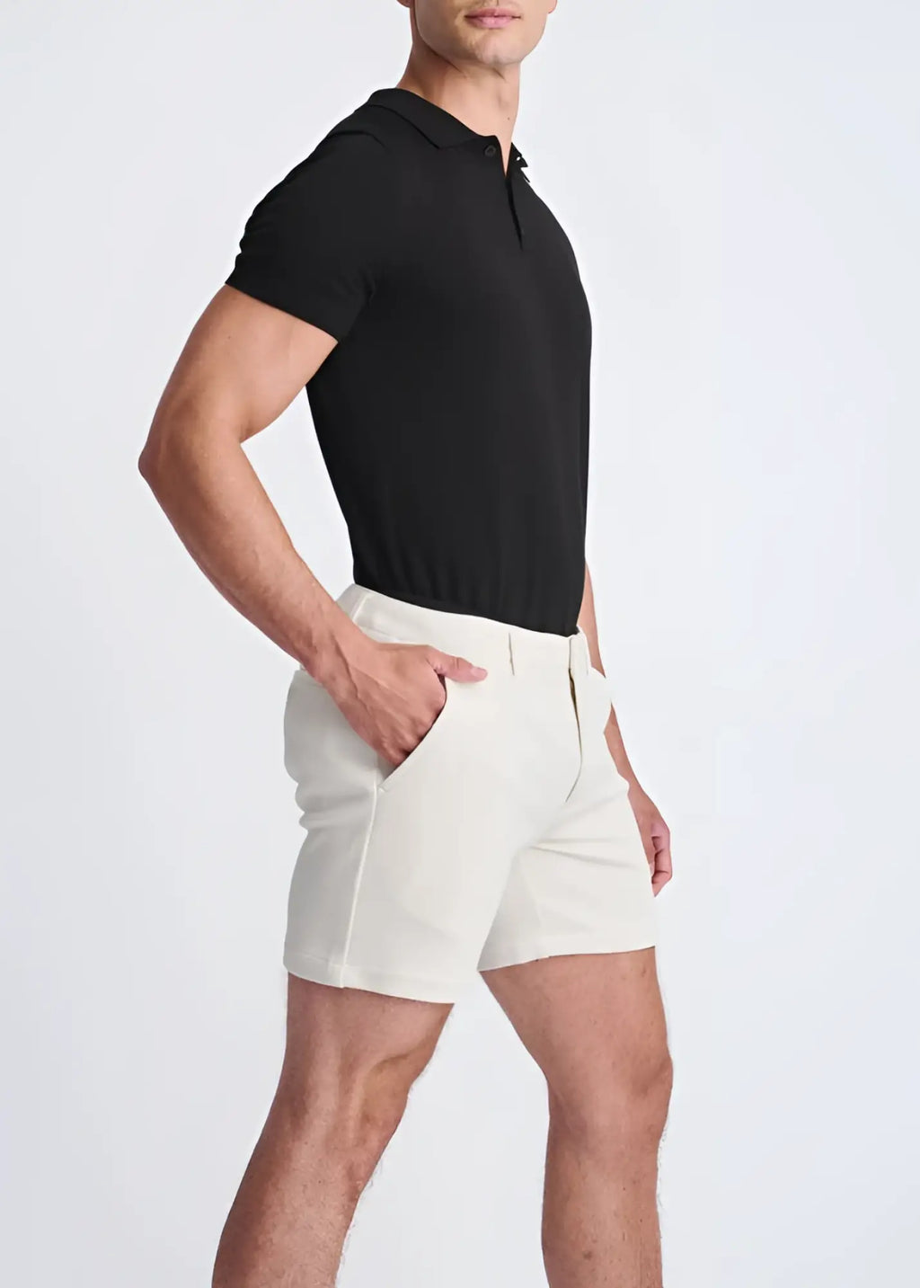 Cream-colored textured stretch knit chino shorts with a modern cut and subtle side seam detailing
