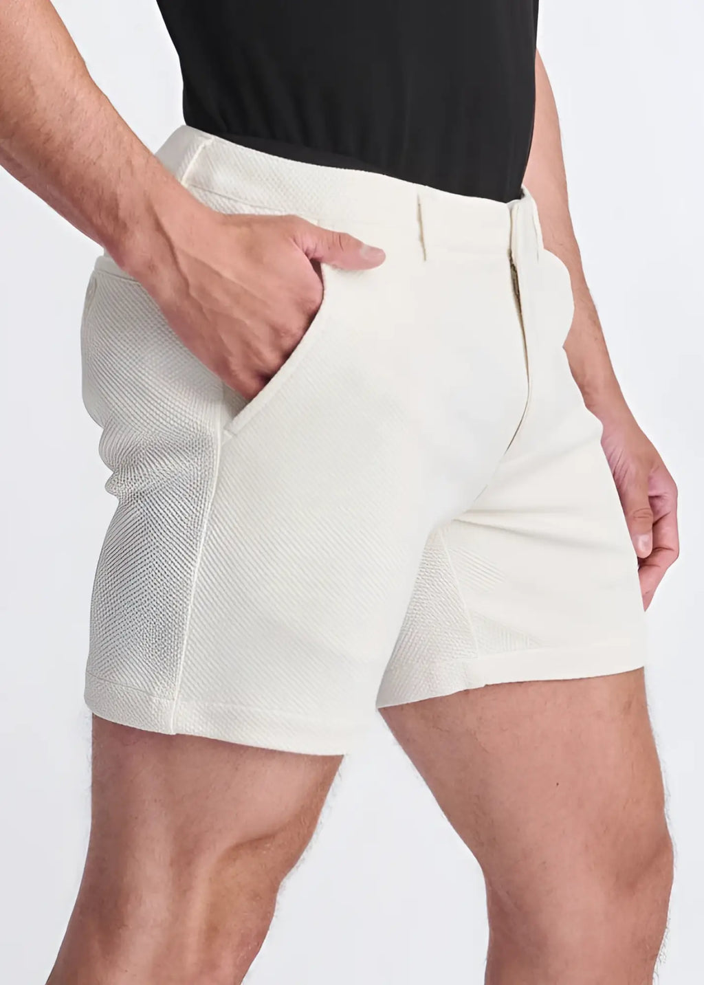 Cream-colored textured stretch knit chino shorts with tailored fit and side pockets for casual wear