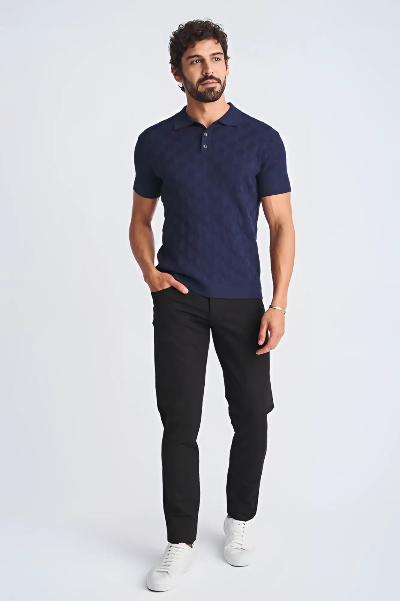Navy blue short-sleeved polo shirt with textured stripes made from silk and tencel featuring a classic collar and buttoned placket