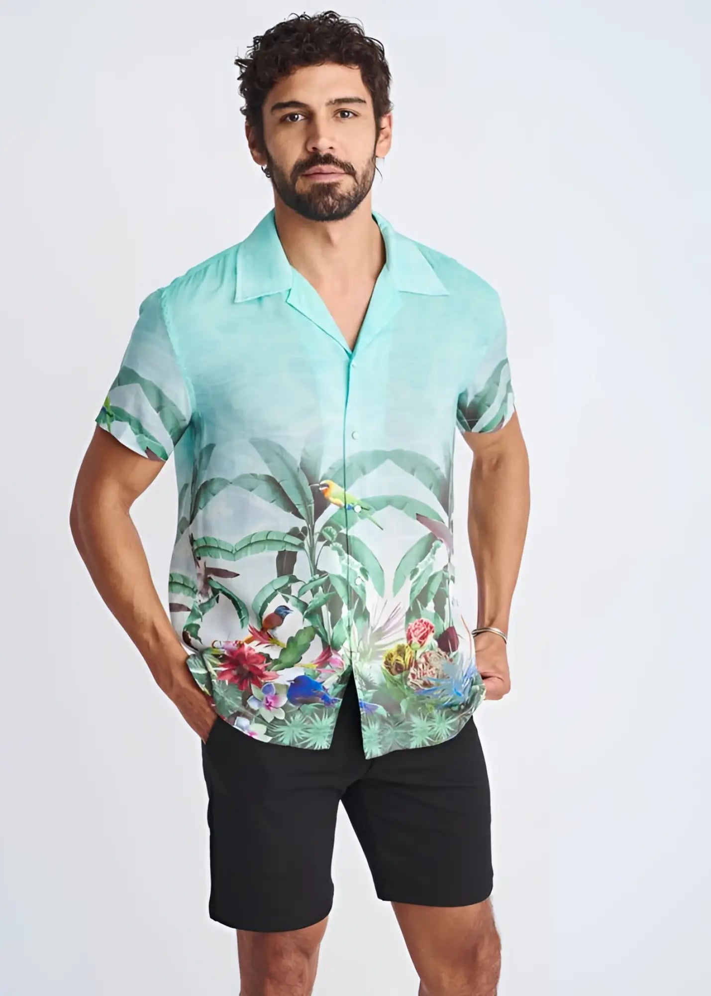 A men’s turquoise short-sleeved modal shirt with tropical leaf and bird print tropics border print s s modal shirt