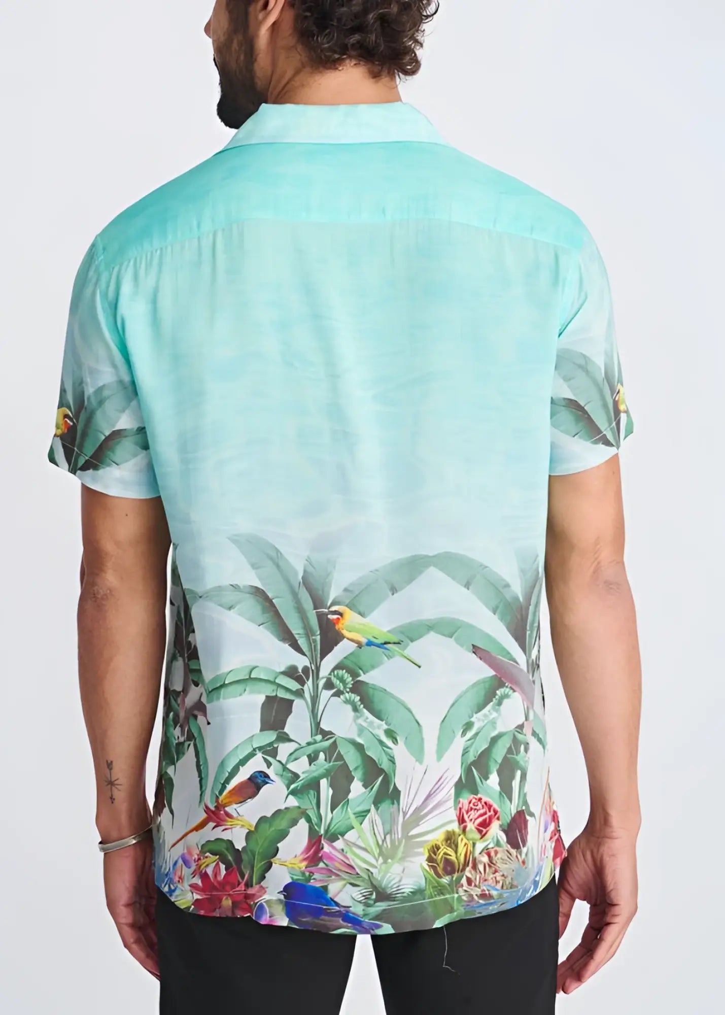 Tropics border print short-sleeved modal shirt in mint green with colorful birds and foliage featuring a relaxed fit