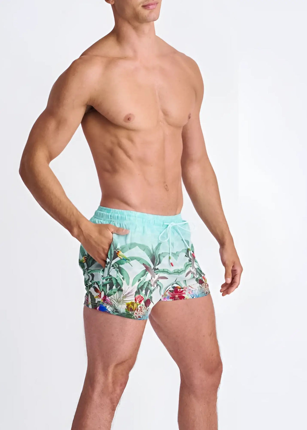 Light blue tropics print swim shorts with vibrant green leaves red flowers colorful birds and mesh lining