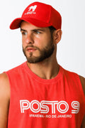 Red baseball cap with white lion silhouette and ca rio ca embroidery complementing posto 9 ipanema tee design