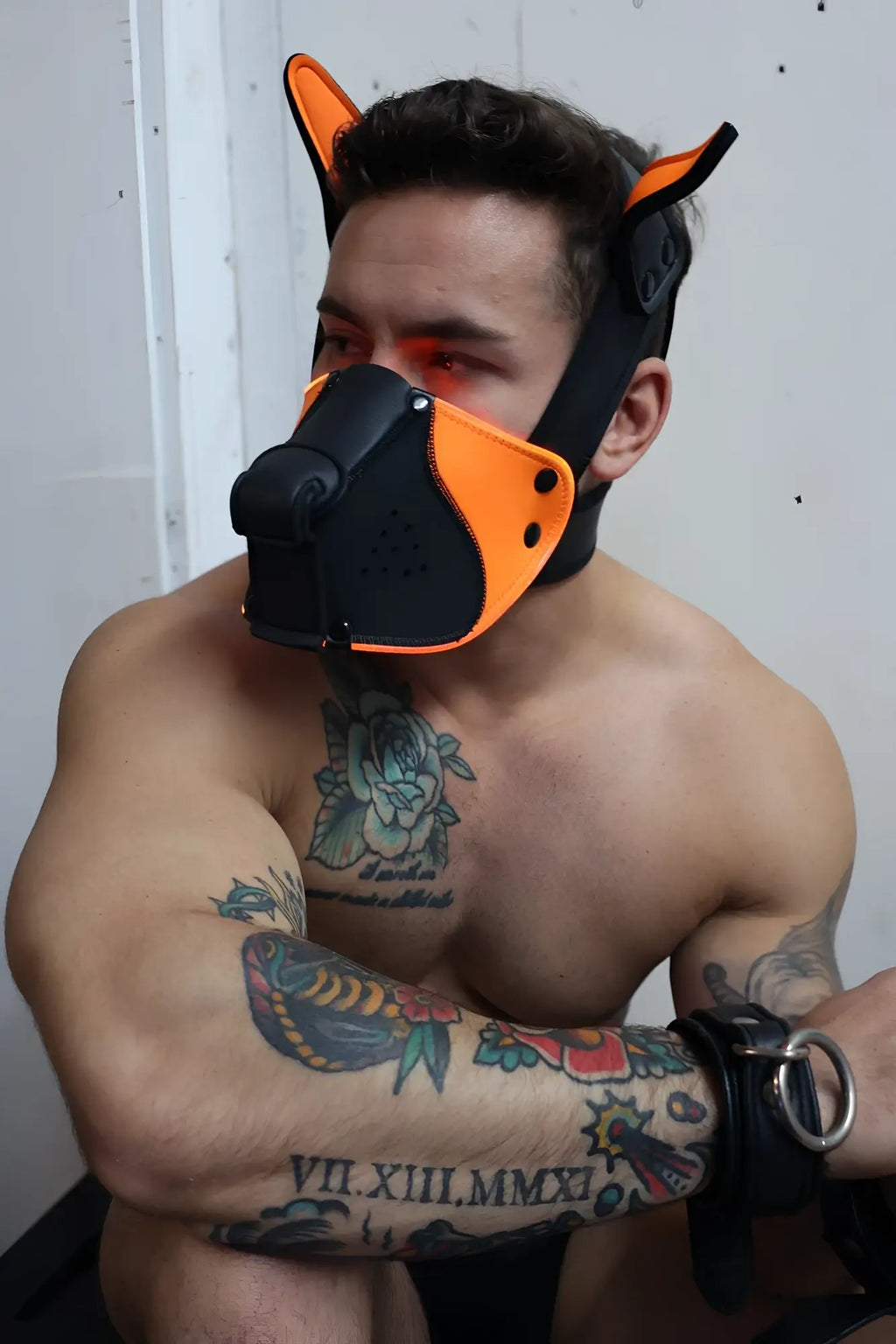 Poundtown pup mask 2.0 neon orange featuring a black and orange dog mask with ear-like protrusions for costume use