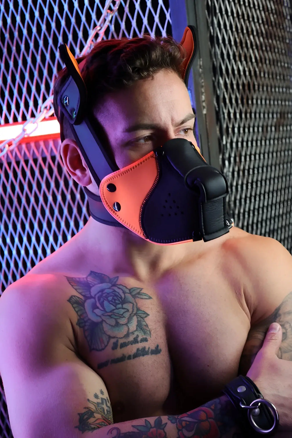 Black and orange leather Poundtown Pup Mask 2.0 with ear attachments in neon orange for dog playwear