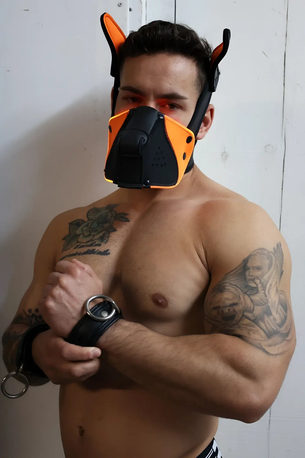 Poundtown pup mask 2.0 neon orange leather dog mask with orange and black colors and ear attachments