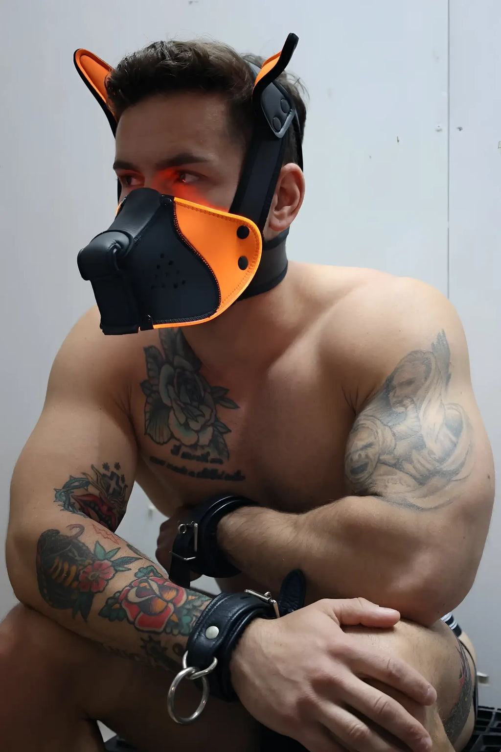 Black and orange leather dog mask with ear attachments poundtown pup mask 2.0 neon orange