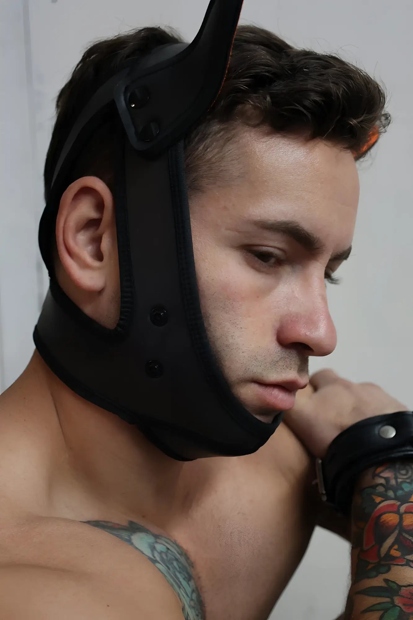 Black neoprene poundtown pup mask 2.0 in neon orange with adjustable straps and rigid curved structure
