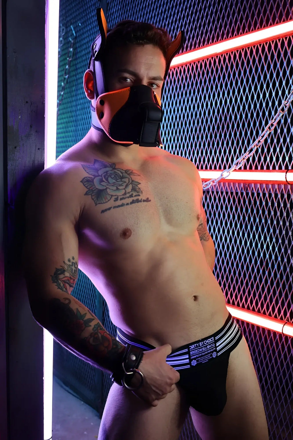 Black briefs with white stripes and blue logo part of poundtown pup mask 2.0 in neon orange color scheme