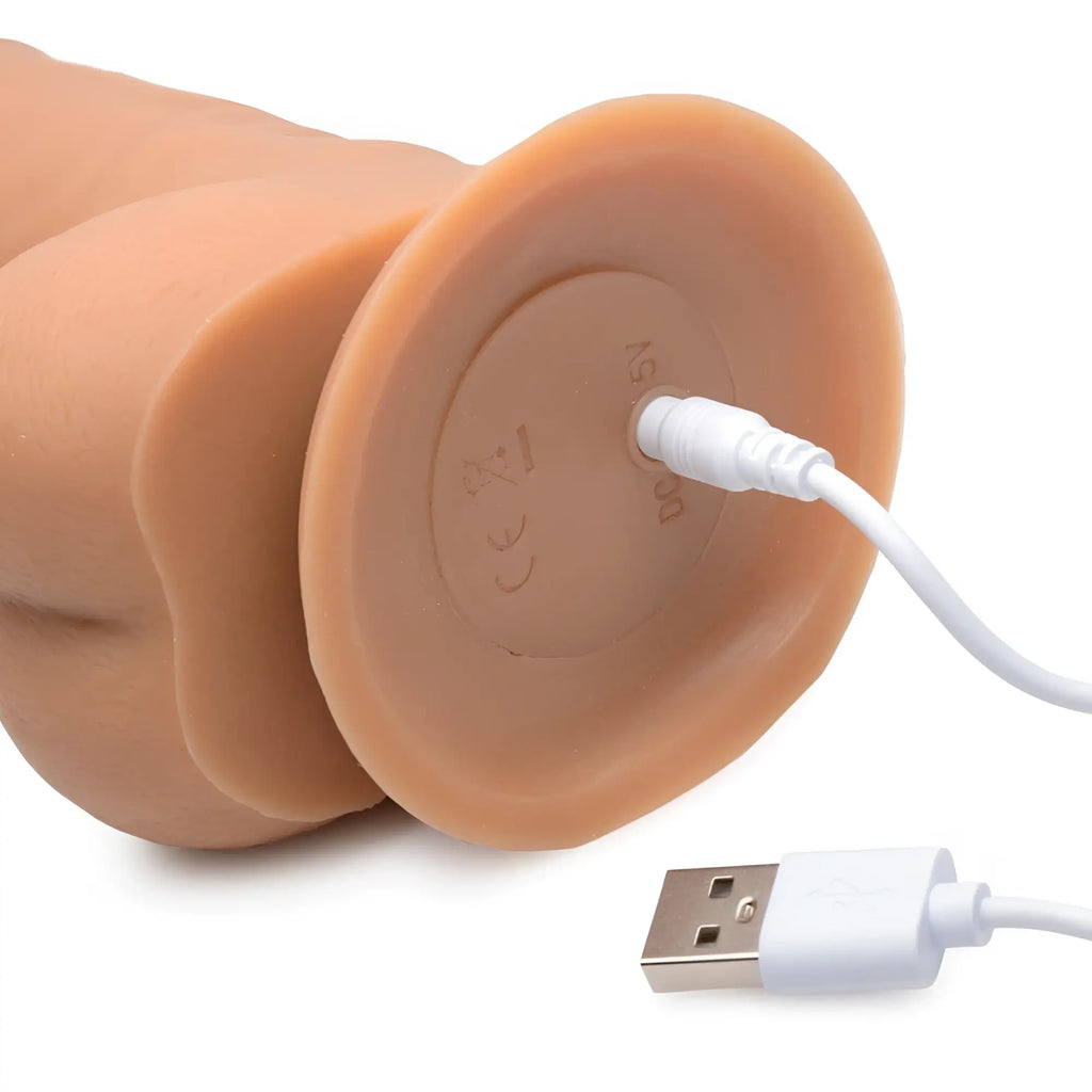 Tan silicone power pounder auto-thrusting realistic dildo with usb charging port and cable shown from the back side