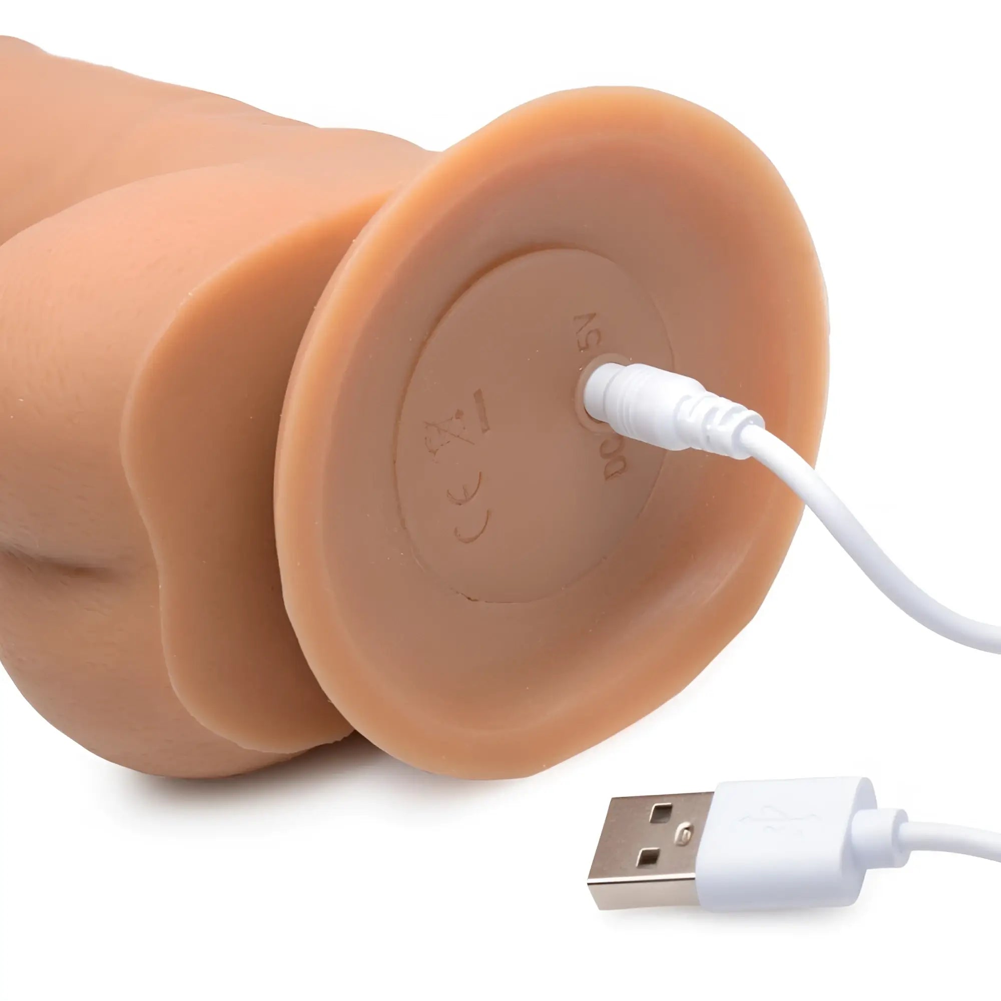 Tan silicone power pounder auto-thrusting realistic dildo with usb charging port and cable shown from the back side