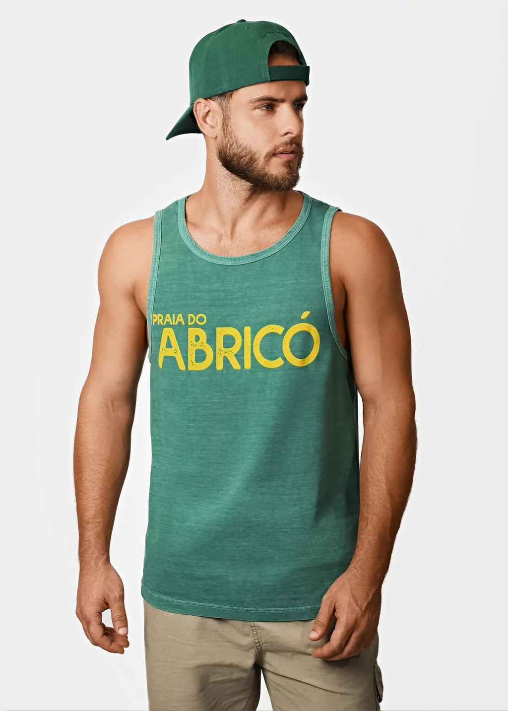 Green men’s tank top with yellow praia do abricó text across the chest perfect for rio famous nude beach wear