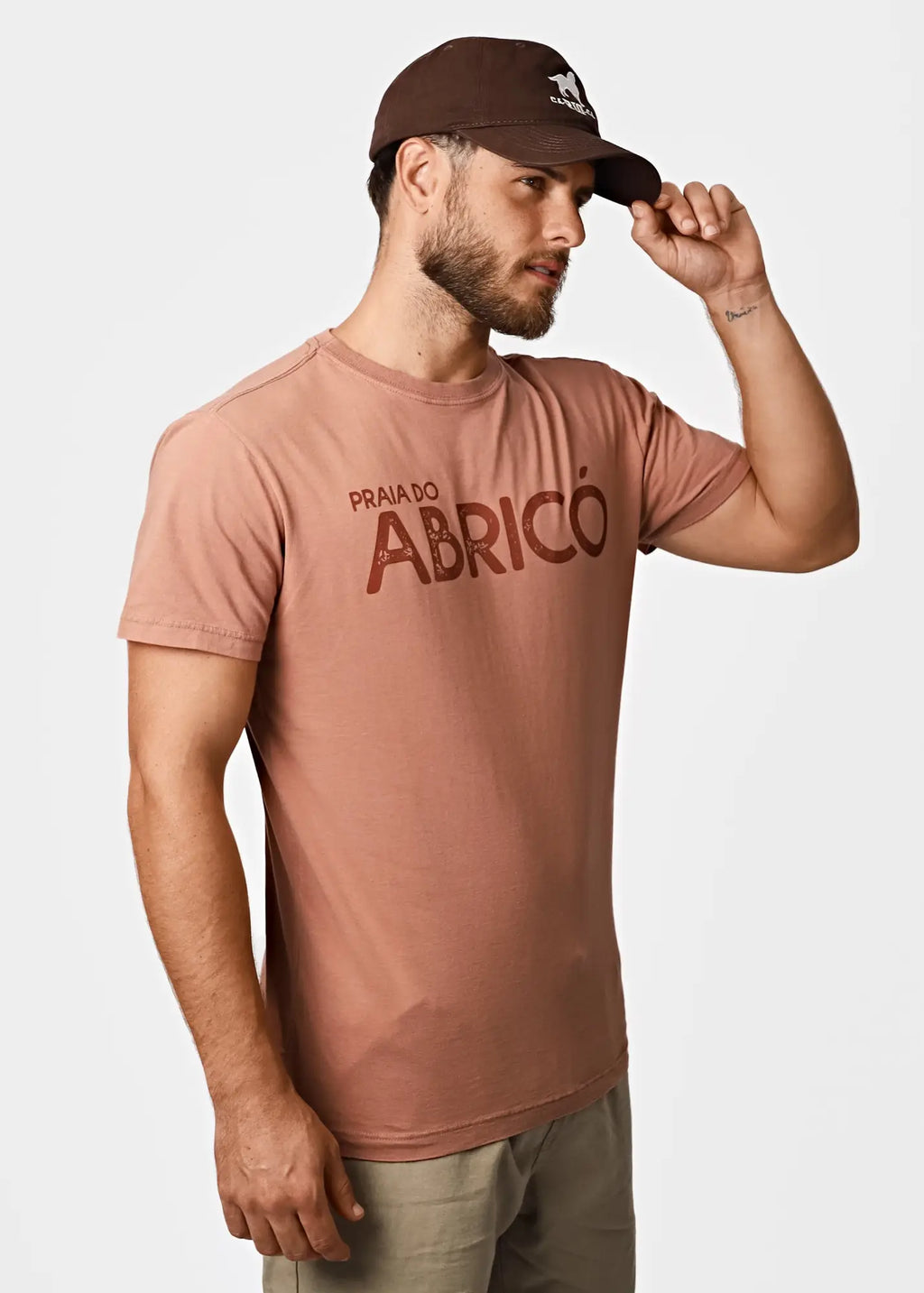Men’s dusty rose cotton t-shirt with bold brown praia do abricó graphic for rio famous nude beach fans