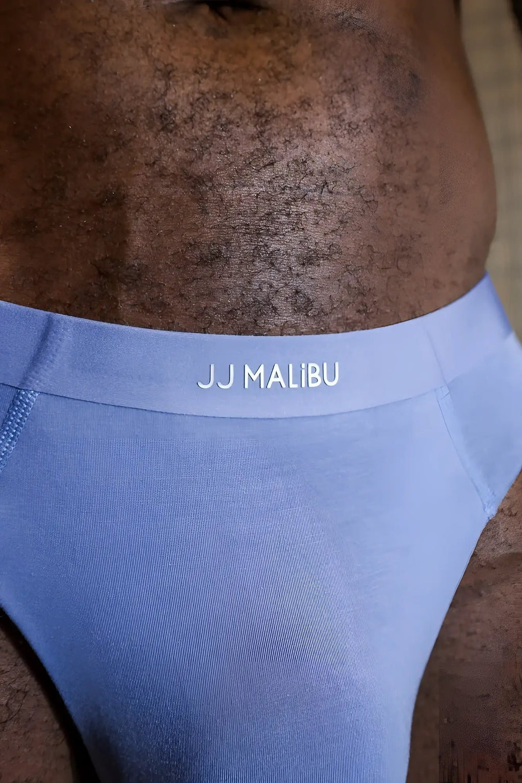 Premium modal athletic thong in steel blue with a smooth stretchy jj malibu waistband featuring white logo lettering