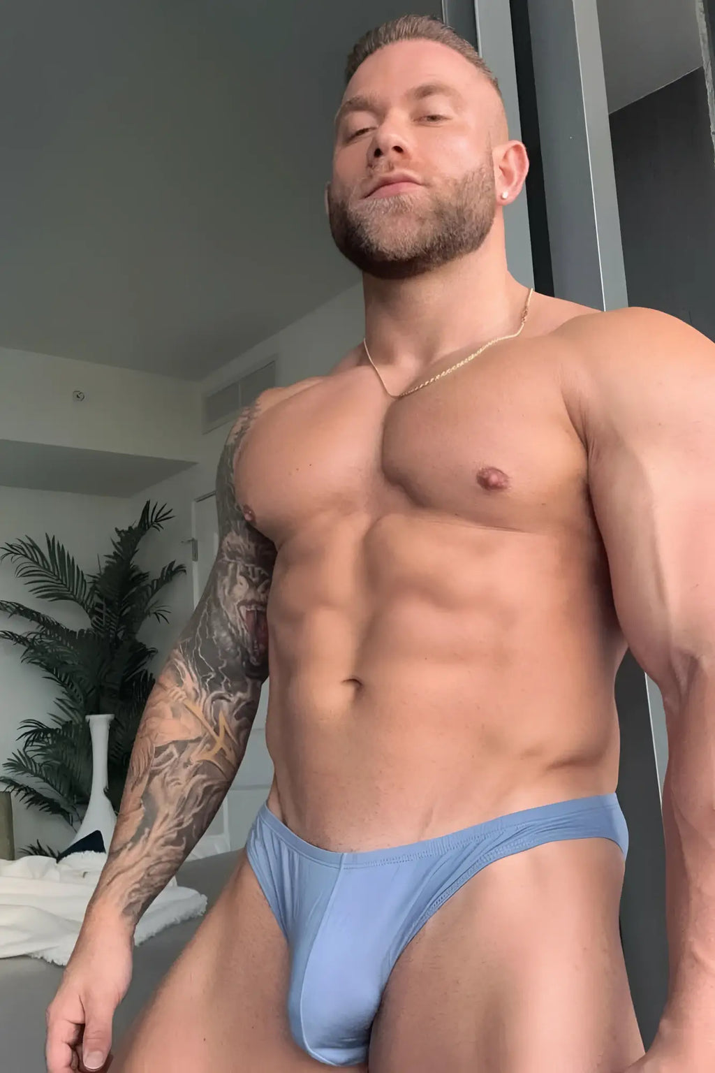 Light blue premium modal scrunch-back briefs shown from the back in periwinkle blue color