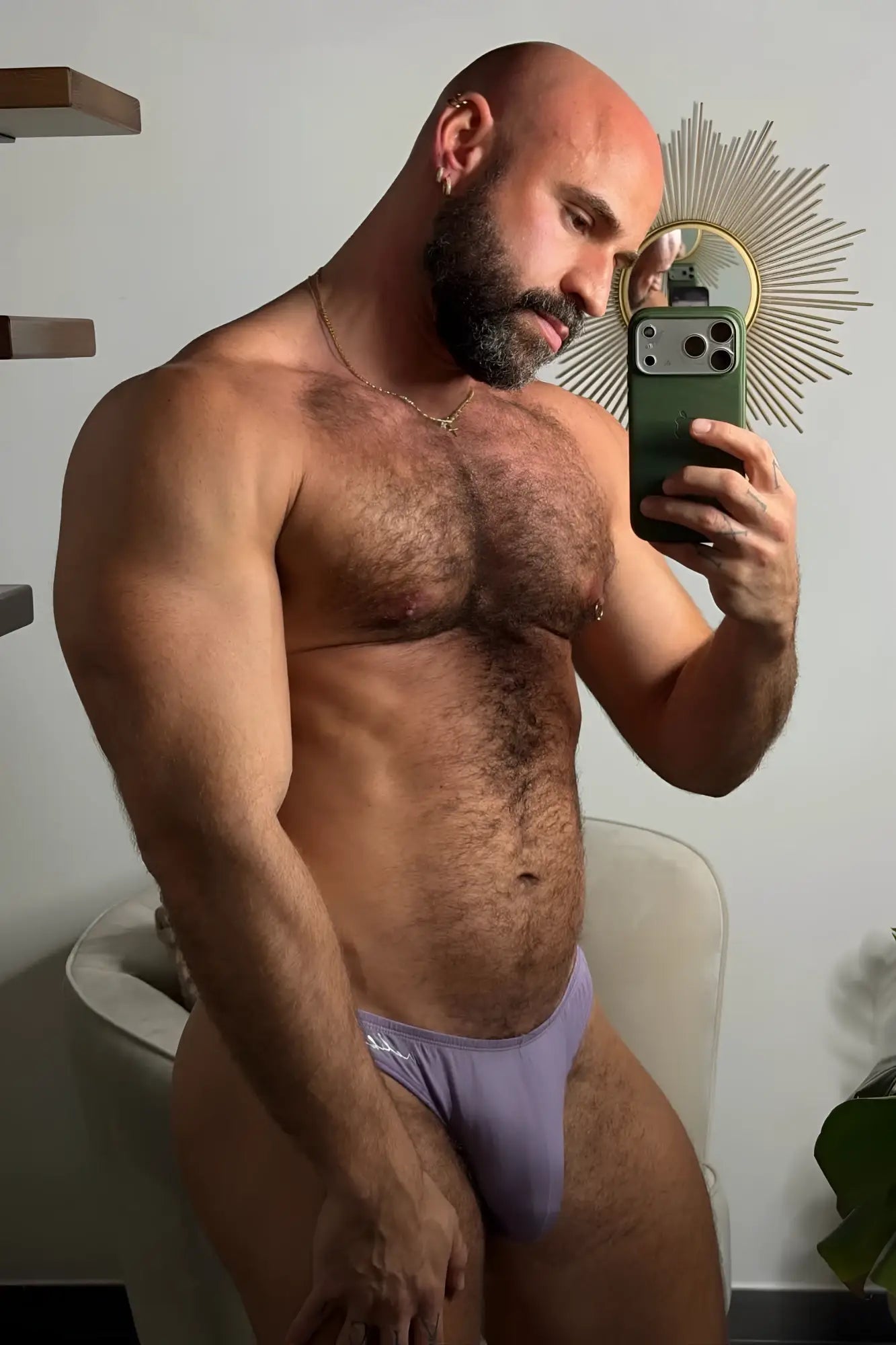 Lavender-colored premium modal scrunch-back thong briefs with subtle logo on waistband shown from back side
