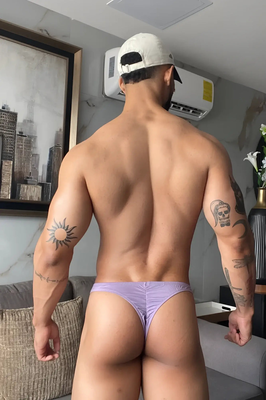 Lavender-colored premium modal scrunch-back thong with textured fabric snug fit and visible seams back side view