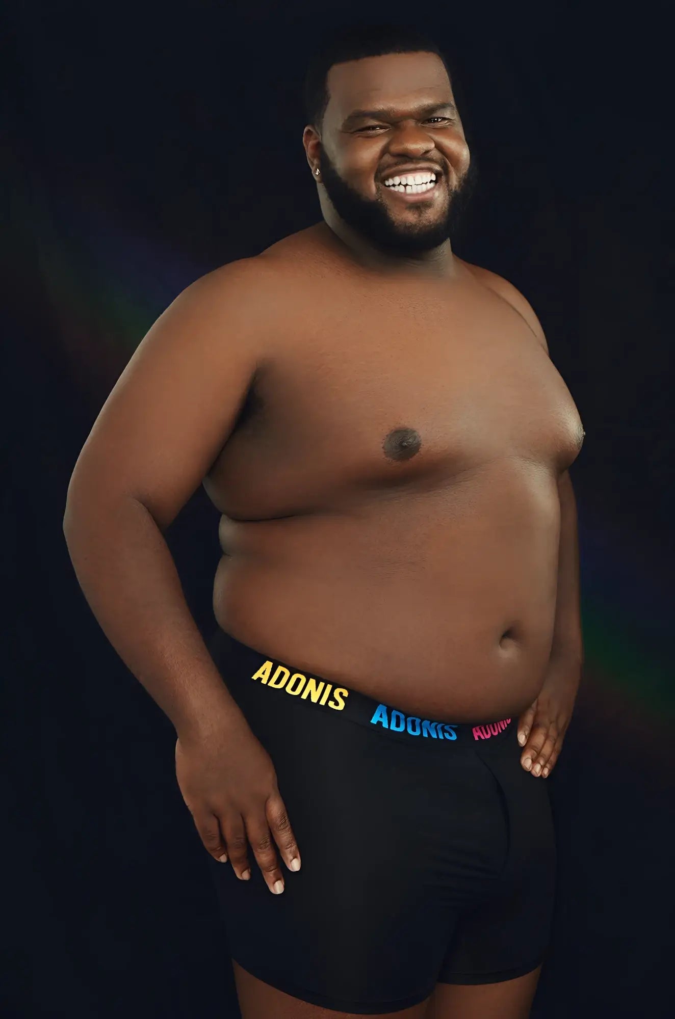 Black pride boxer shorts featuring adonis in yellow blue and pink lettering on the waistband