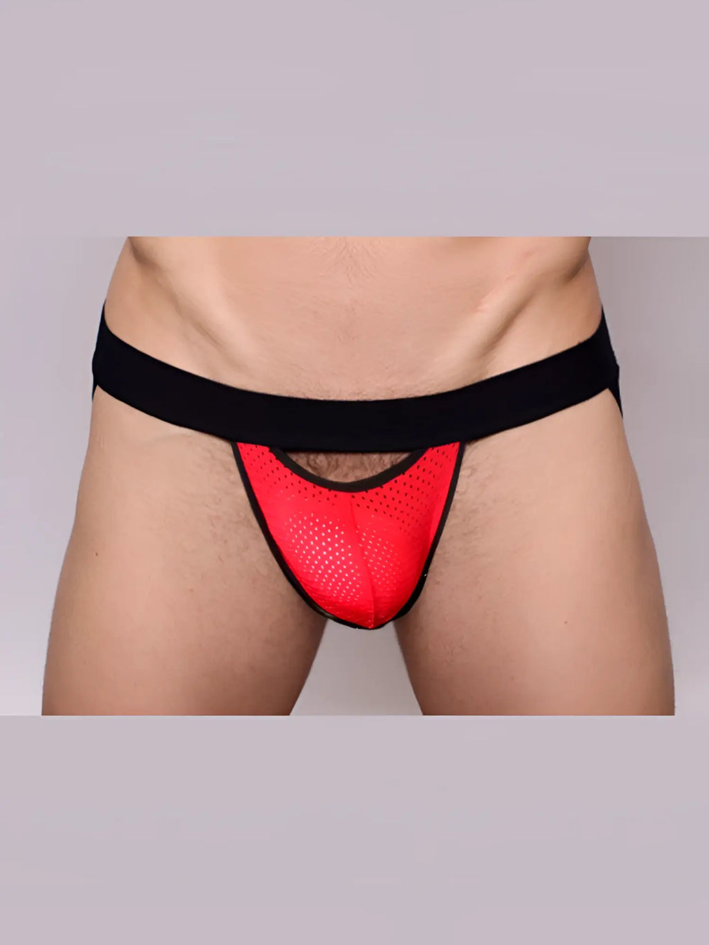 Red mesh thong jockstrap with black elastic waistband and trim from pride drop collection shown from the front