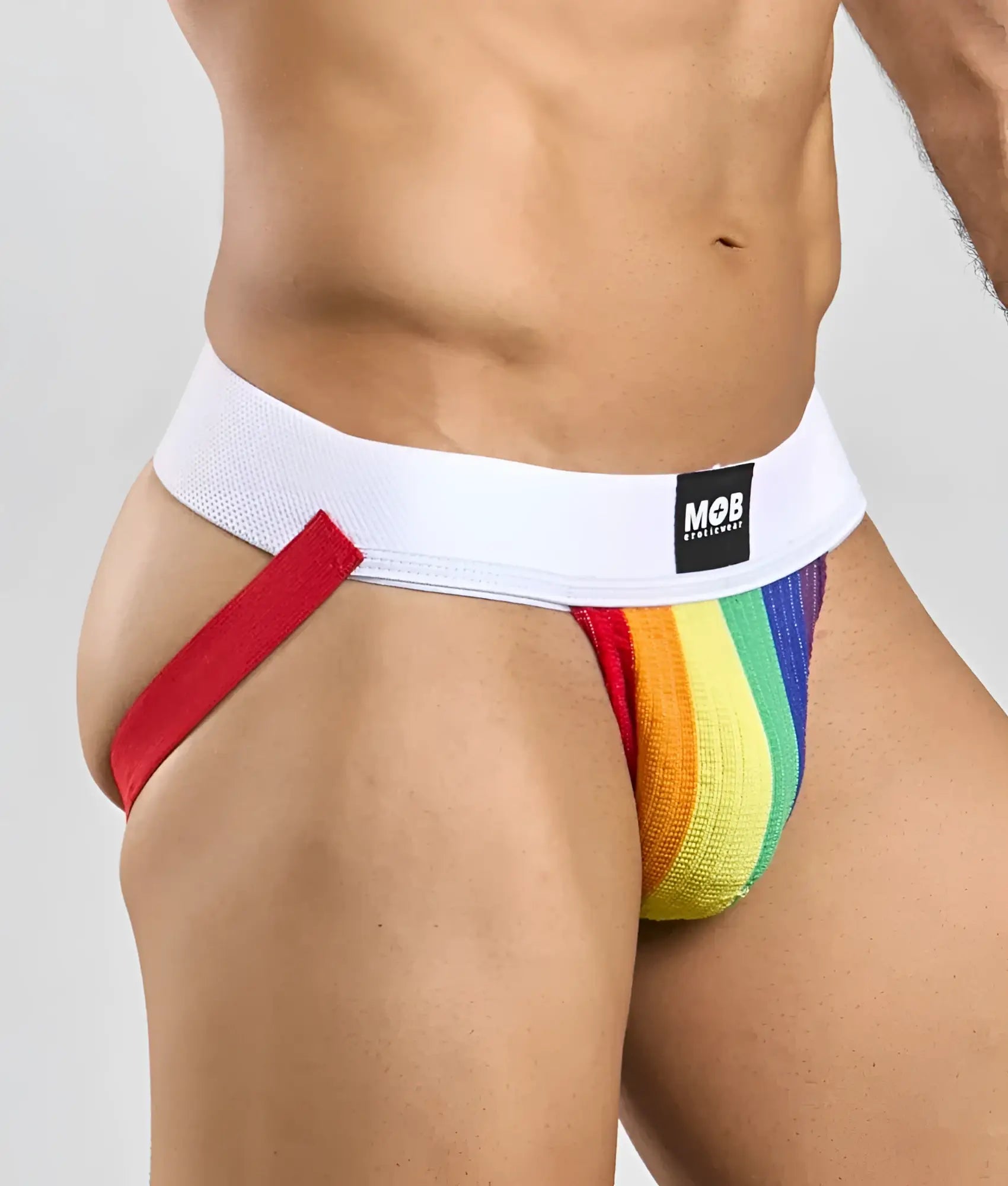 Pride flag colors jockstrap with rainbow stripes, white waistband, red side strap, featuring mob underwear logo