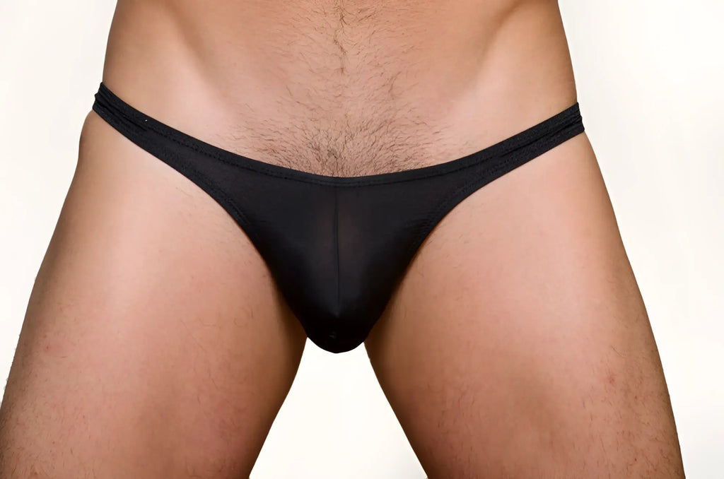 Black sheer mesh pride metro thong with plus pouch featuring a narrow waistband shown from the back side