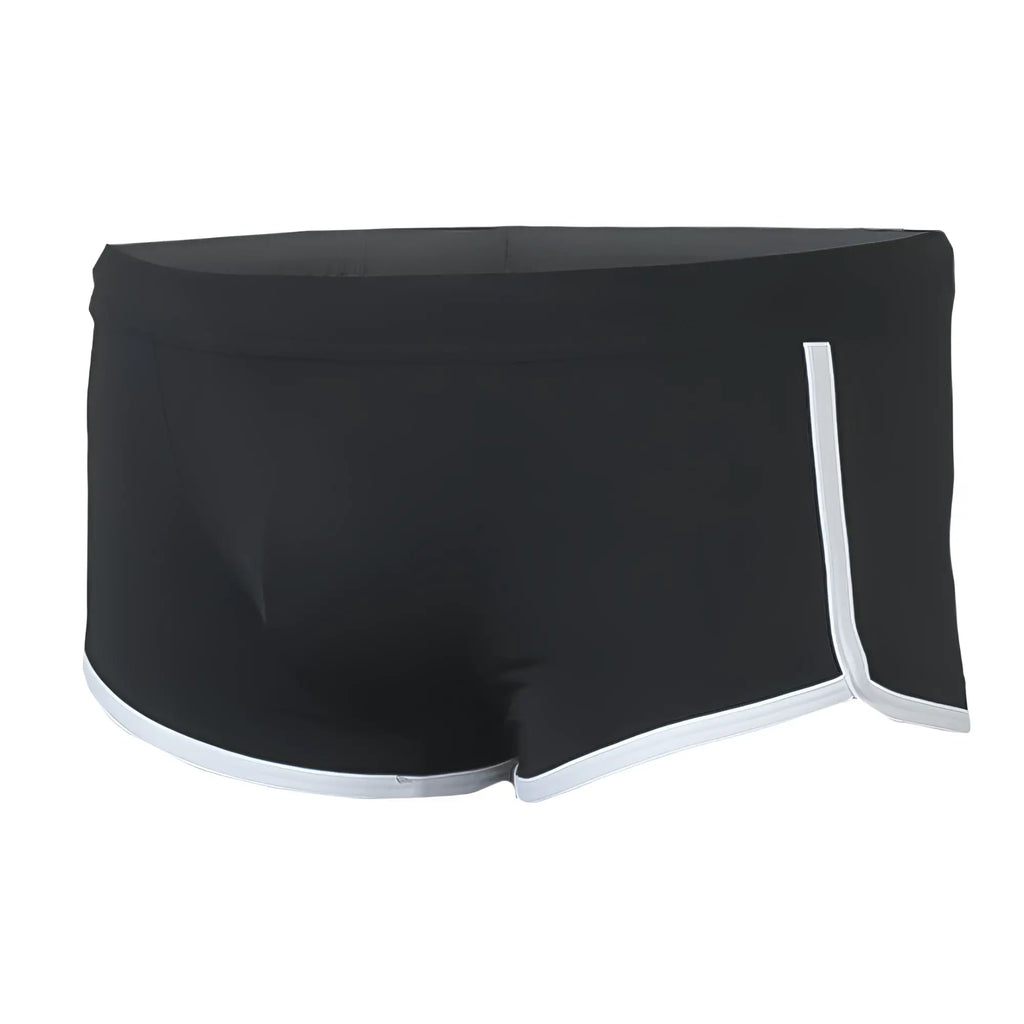 Black Pride Vince Trunk swim trunks with white trim along waistband and leg openings for beachwear use