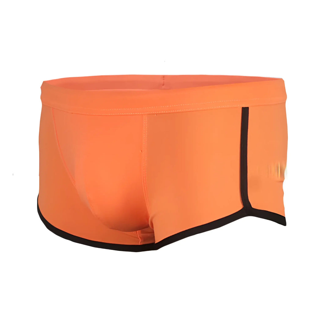 Bright orange pride vince trunk swim trunks with black trim along waistband and leg openings for swimming