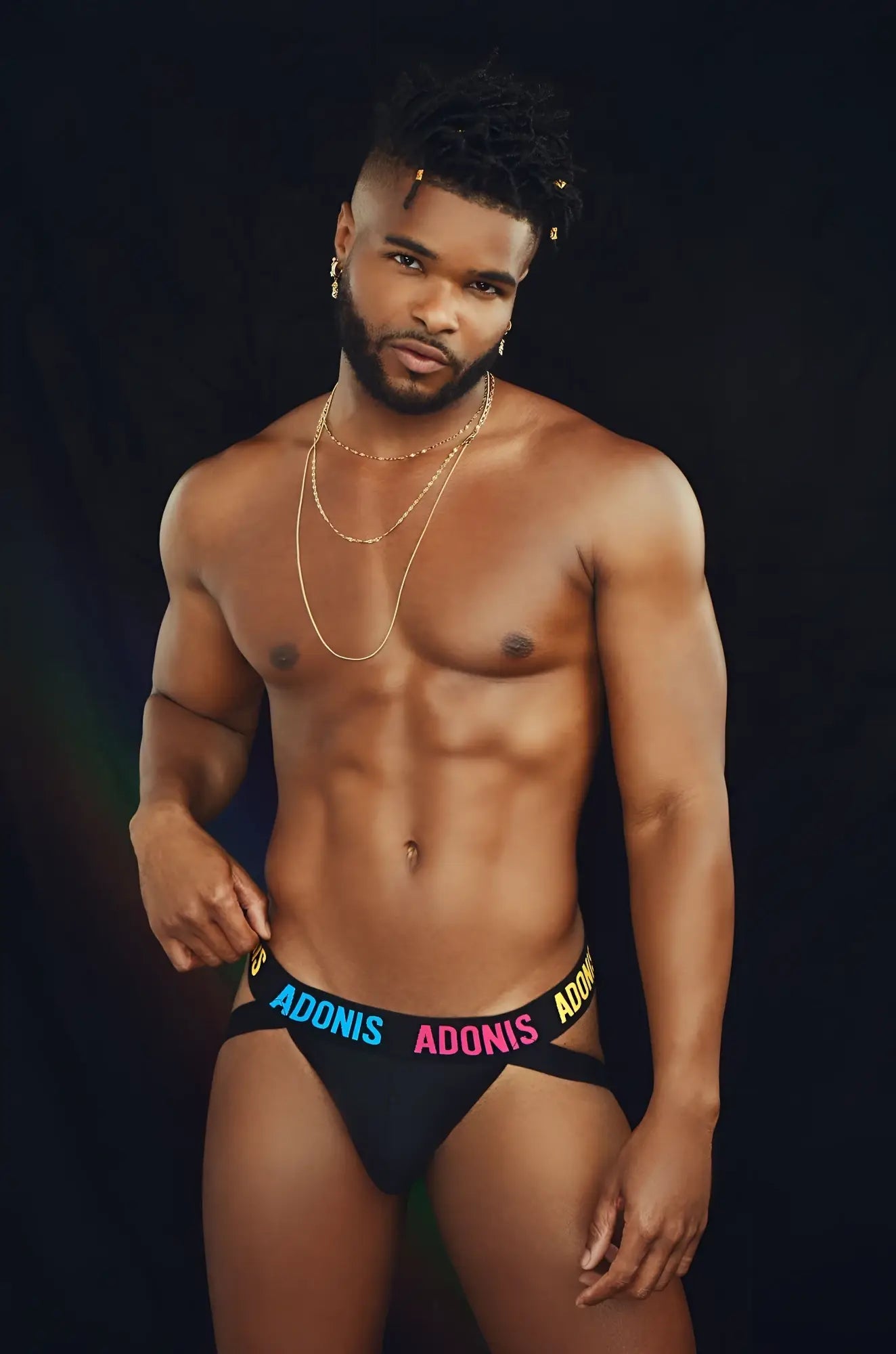 Black pride365 jockstrap briefs with blue and pink adonis lettering on the waistband for pride wear