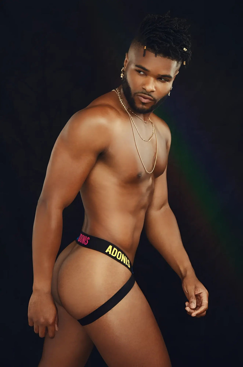 Black pride365 jockstrap briefs with adonis in yellow and pink lettering on the front