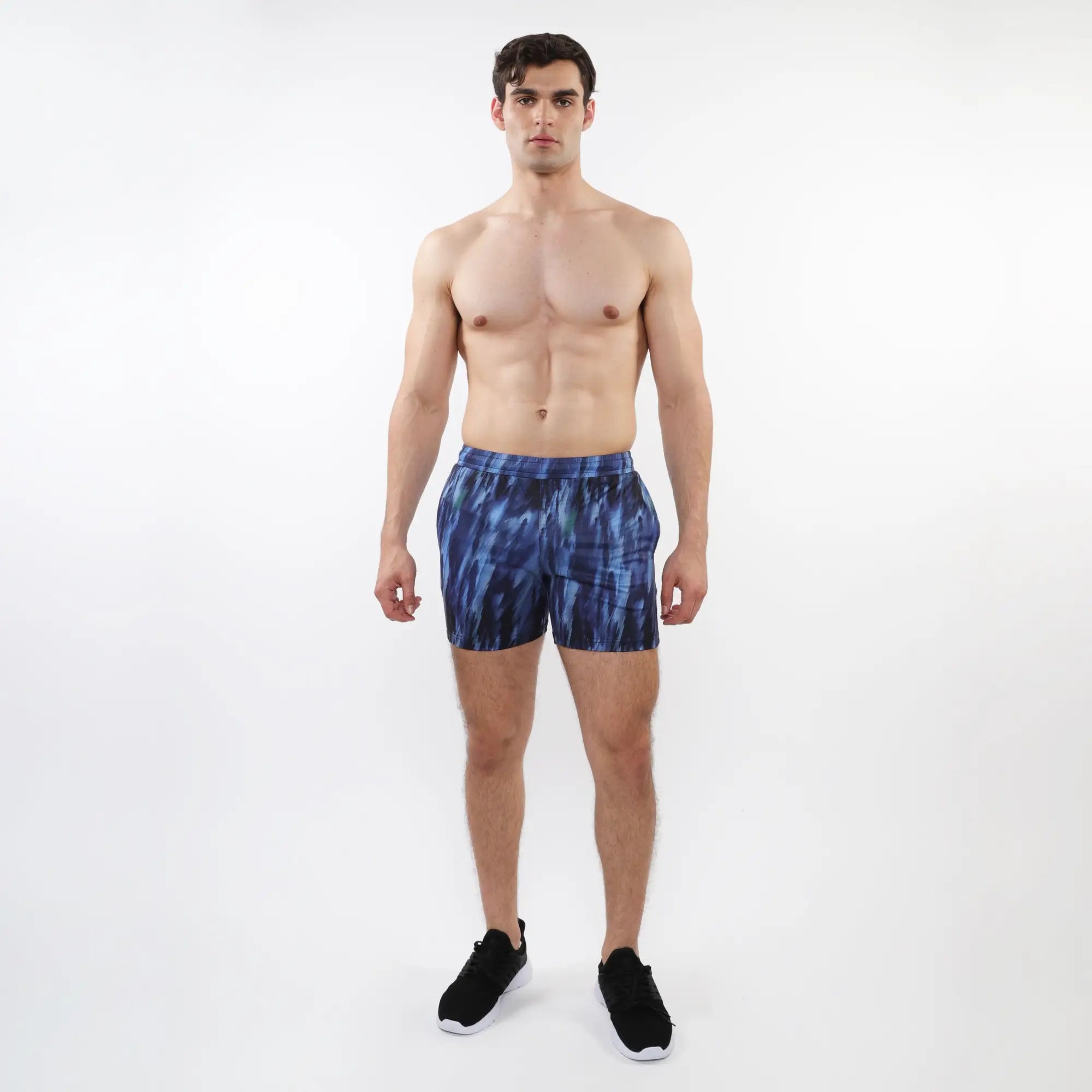 Blue tie dye printed mesh stretch performance athletic shorts with a modern abstract pattern
