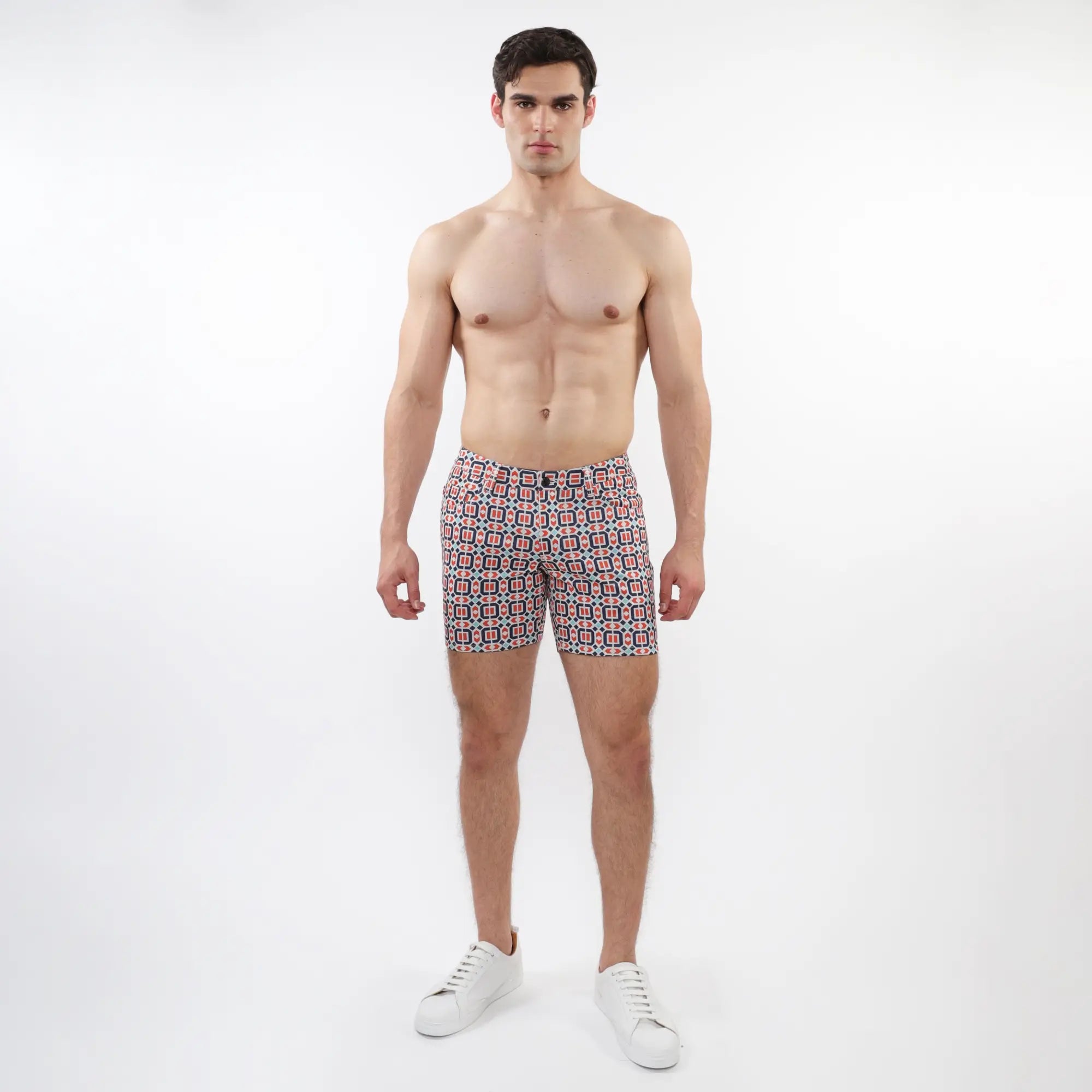 Printed stretch knit short men’s swim trunks with geometric red blue and white pattern in lightweight fabric