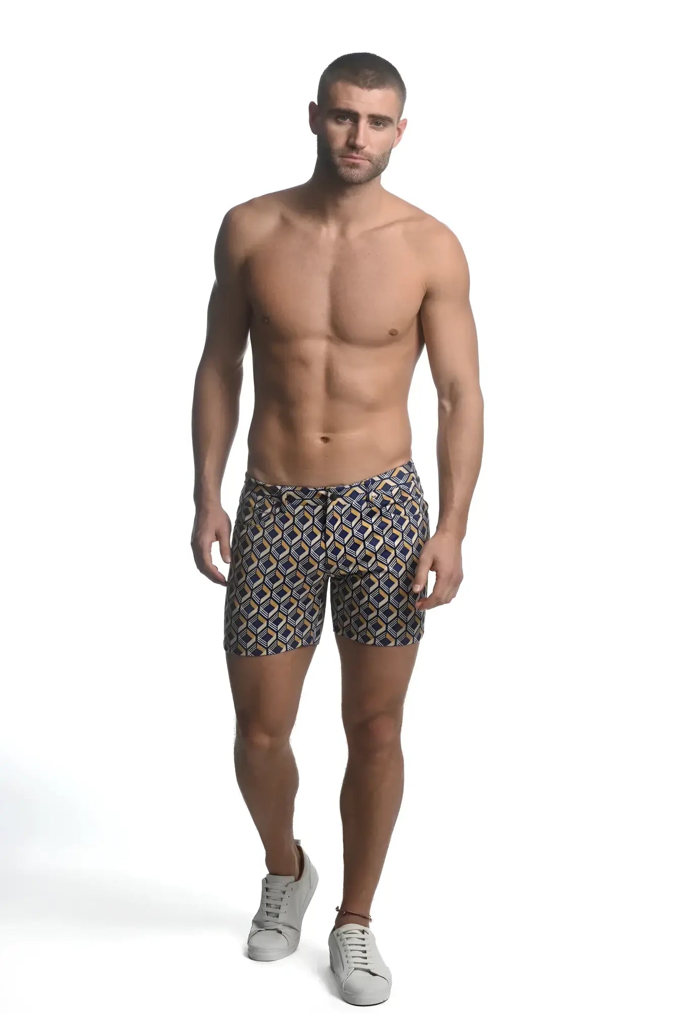 Printed stretch knit short men’s swim trunks with navy beige and gold geometric pattern in lightweight fabric