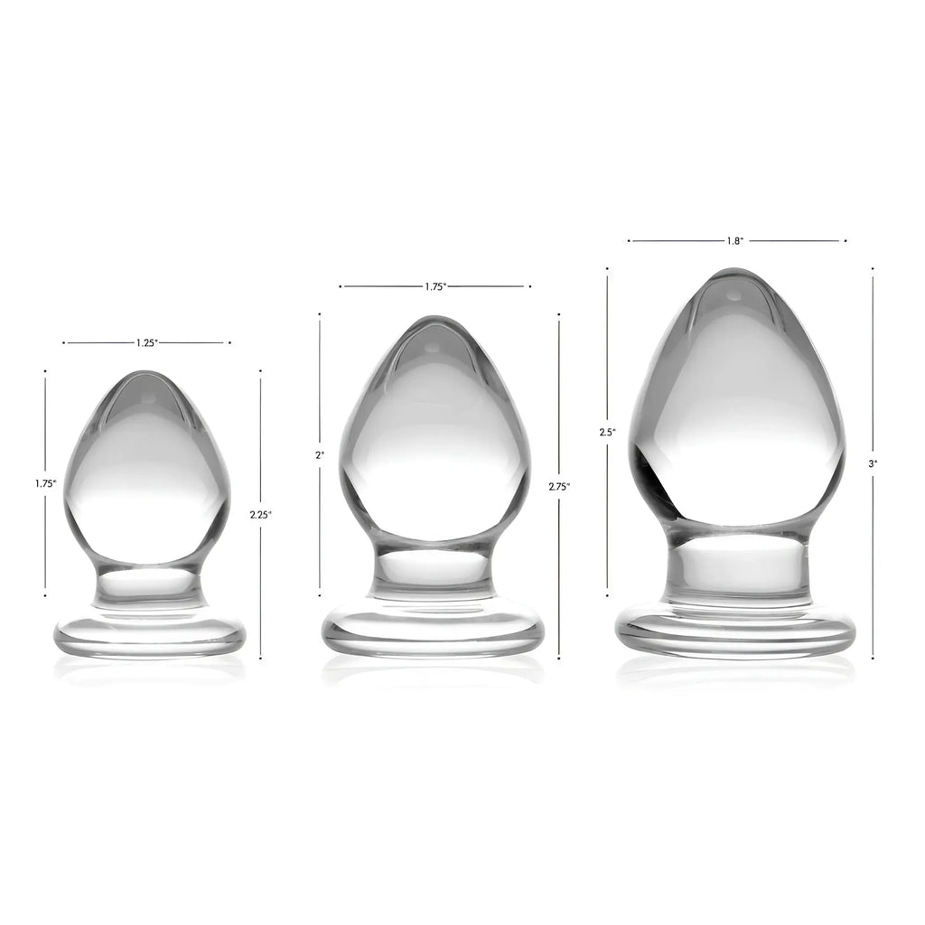 Prisms Erotic 3-piece clear glass anal plug set, showing varying sizes with measurement dimensions in a white background.